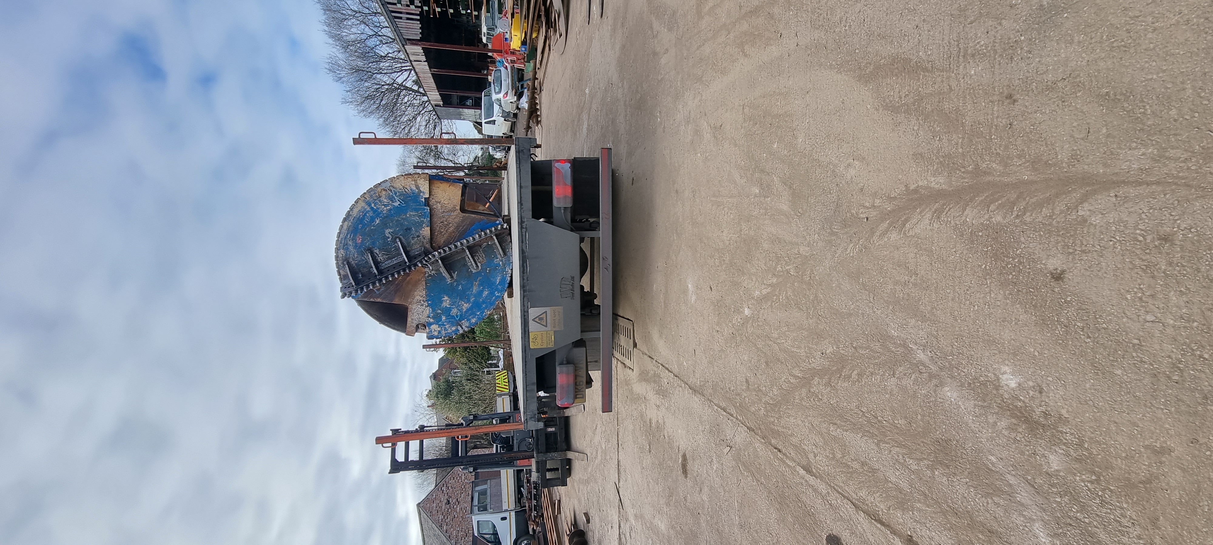 Rebuilt bucket loaded onto the transport.